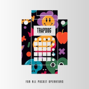 May include: A colourful sticker skin for the Pocket Operator synthesizer. The skin features a black background with a variety of colourful graphics, including a smiley face, a flower, an apple, and a skull. The text "TRAPDOG PRODUCER'S PLUG" is printed in white on a black background. The skin is designed to fit the Pocket Operator synthesizer and is intended to be used as a decorative accessory.