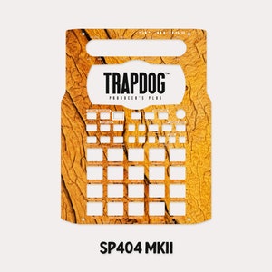 May include: A gold and brown patterned skin for the Roland SP-404 MKII sampler. The skin features the text "TRAPDOG PRODUCER'S PLUG".