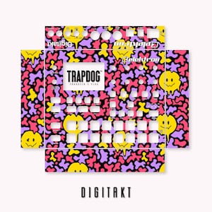 May include: A black and white graphic design skin for the Elektron Digitakt sampler, featuring a pink, yellow, and purple camouflage pattern with smiley faces. The text "TRAPDOG" is printed in white on a black background.