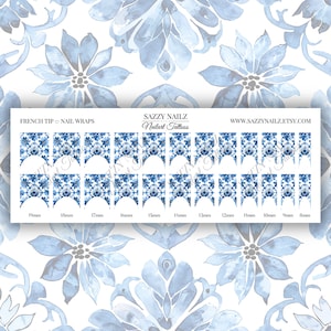 May include: A sheet of 18 blue and white nail wraps with a floral pattern. The nail wraps are sized for different nail sizes, ranging from 8mm to 19mm. The text "FRENCH TIP NAIL WRAPS" and "SAZZY NAILZ Nailart Tattoos" is printed at the top of the sheet.