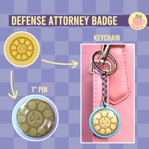 May include: A gold and brown 1-inch pin and a keychain with a blue circle around a gold and brown design. The design features a scale of justice inside a circle with eight points. The text "DEFENSE ATTORNEY BADGE" and "KEYCHAIN" are visible in the image.