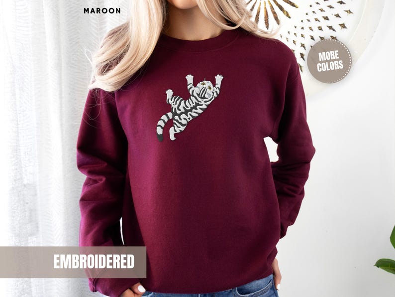 Climbing Cat Sweatshirt Embroidered Design Women Grey Tabby Kitten Pullover Top Novelty Animal Apparel Cozy Cotton Blend Soft Comfortable Fit Large Chest Detail Perfect Cat Mom Gift Pet Parent Present Birthday Occasion Cat Lover Essential