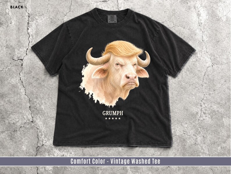 Black Comfort Colors GRUMPH buffalo graphic T-shirt flat lay with grumpy albino buffalo portrait.