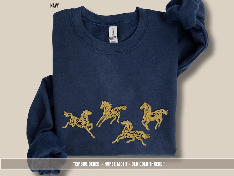 Navy blue unisex sweatshirt featuring old gold & black embroidered horses across the chest