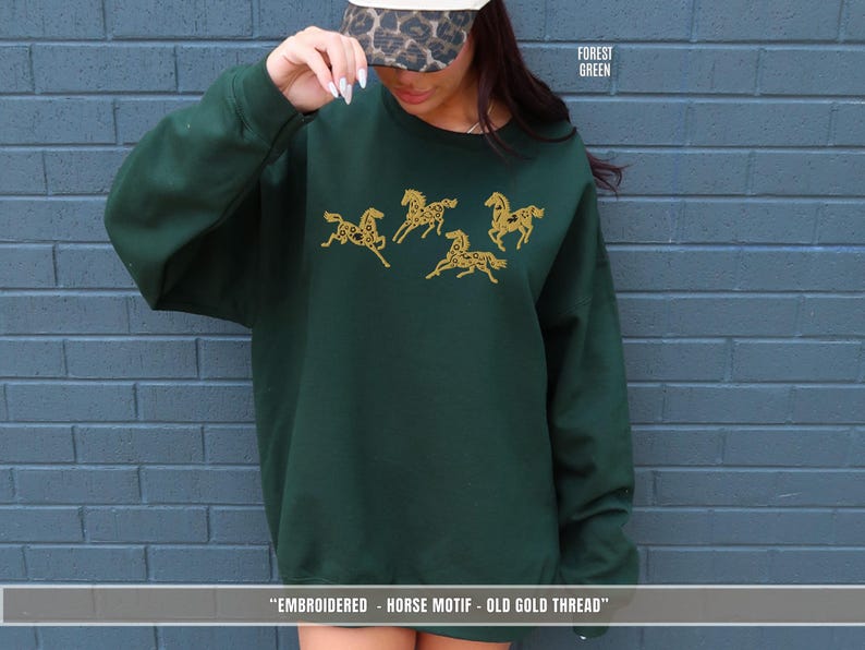 Forest green sweatshirt with old gold & black embroidered horse design inspired by equestrian riding culture