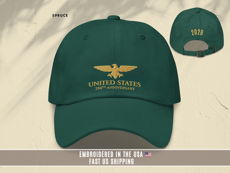 Light blue embroidered United States 250th anniversary baseball cap with eagle emblem, worn outdoors in natural light.