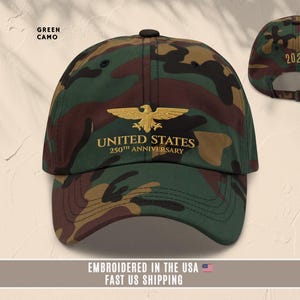 Camouflage embroidered United States 250th anniversary cap with gold eagle design, front and back view.
