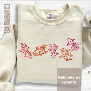 Aquarium Enthusiast Sweatshirt Embroidered Goldfish Design Fishkeeper Hobby Clothing Aquarist Gift Idea Fancy Fish Apparel Koi Aesthetic Shirt Dad Present For Fish Lover Colorful Aquatic Themed Wear Orange Red Pink Details Pet Fish Owner