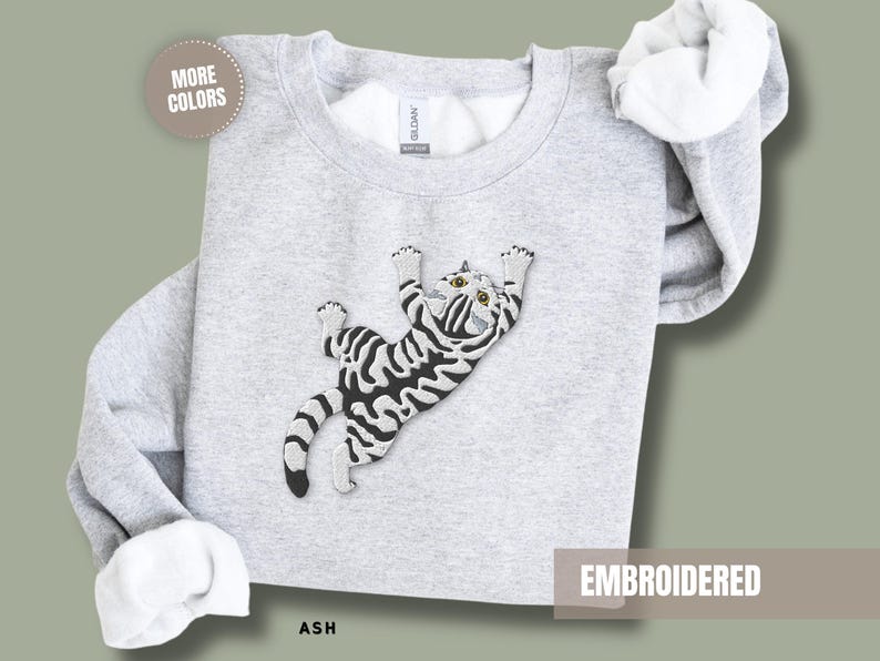 Animal Lover Sweatshirt Women Embroidered Cat Design Grey Tabby Kitten Climbing Feline Pullover Top Pet Parent Apparel Cat Mom Gift Idea Cozy Cotton Blend Soft Comfortable Construction Large Chest Detail Birthday Present Cat Lady Essential