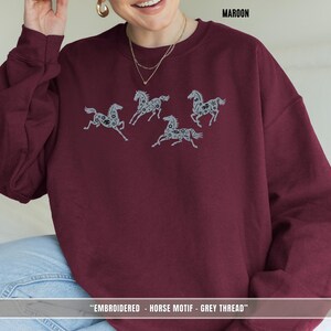 Maroon unisex sweatshirt with soft grey & black embroidered horses for horse lovers and riders