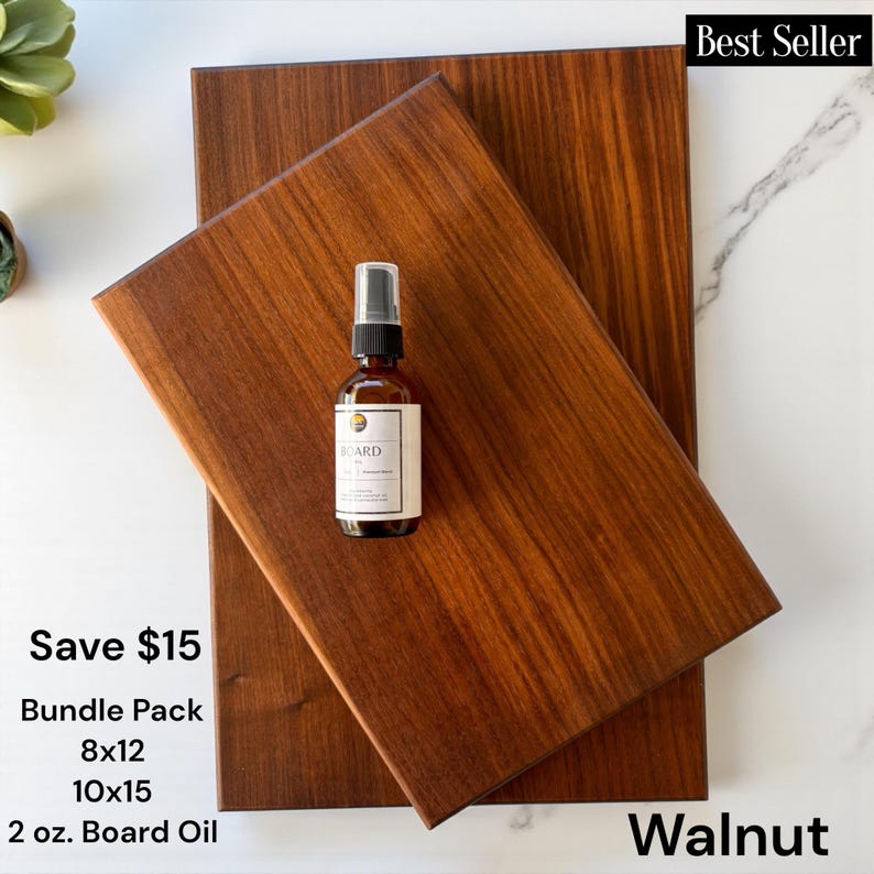 May include: Two rectangular walnut wood cutting boards with a smooth finish, layered one over the other. A small amber glass spray bottle labeled Board Oil sits on the top board. The text on the image includes Best Seller, Save $15, Bundle Pack, 8x12, 10x15, 2 oz. Board Oil, and Walnut.