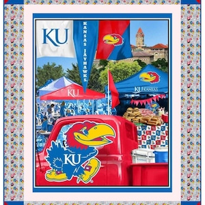 May include: A red, white, and blue Kansas Jayhawks themed quilt with a truck, tents, and flags. The truck has a large Jayhawk logo on the side and the text "KU". The tents have the text "KU" and "KU Kansas Jayhawks". The flags have the text "KU" and "Kansas Jayhawks".