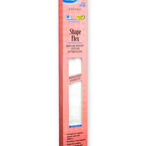 May include: A tall, rectangular pink box of Pellon Shape Flex iron-on woven cotton interfacing, style SF101. The packaging features blue and white text, a machine safe icon, and a clear window showing the white fabric inside, measuring 15 inches by 2 yards.