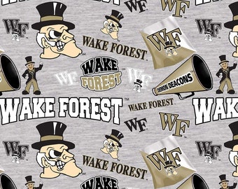 May include: A gray fabric with a repeating pattern of Wake Forest Demon Deacons logos, including the school mascot, a demon, and the words "Wake Forest" and "Demon Deacons".