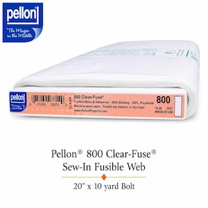 May include: A bolt of white Pellon 800 Clear-Fuse sew-in fusible web. The packaging label displays the product name, 100% polyamide composition, care instructions, and a 20-inch width. The bolt is white, rectangular, and wrapped in clear plastic.