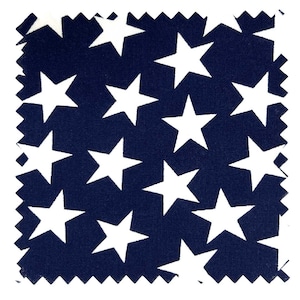 May include: A square fabric swatch featuring a dark navy blue background with a repeating pattern of solid white five-pointed stars. The edges of the fabric are cut with a zigzag pinking shear finish on all four sides.