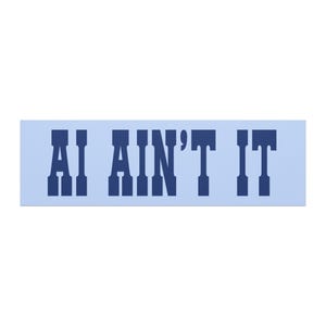 May include: A rectangular sticker with a light blue background featuring the dark blue text AI AIN'T IT in a bold, blocky, serif font. The design is centered on the horizontal surface, presenting a clear and legible message in a simple, high-contrast color scheme.