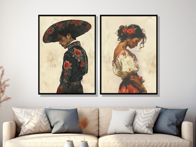 May include: Two framed paintings depicting a man and a woman in traditional Mexican attire. The man is wearing a black suit with red floral embroidery and a wide-brimmed hat with red roses. The woman is wearing a white blouse with red floral embroidery and a red skirt. Both figures are looking down.