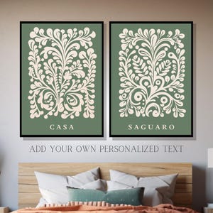 May include: Two green framed prints with white floral designs. The print on the left says "CASA" and the print on the right says "SAGUARO".