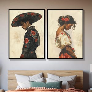 May include: Two framed paintings depicting a man and a woman in traditional Mexican attire. The man is wearing a black suit with red roses embroidered on it and a wide-brimmed hat. The woman is wearing a white blouse with red embroidery and a red skirt. Both figures are looking down.