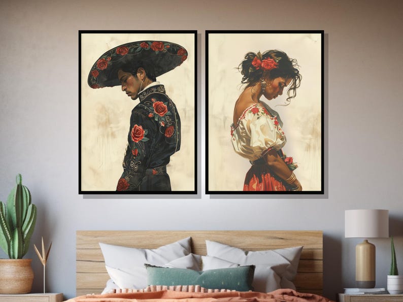 May include: Two framed paintings depicting a man and a woman in traditional Mexican attire. The man is wearing a black suit with red roses embroidered on it and a wide-brimmed hat. The woman is wearing a white blouse with red embroidery and a red skirt. Both figures are looking down.