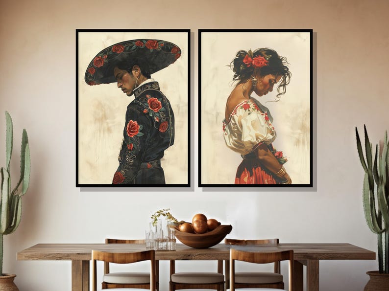 May include: Two framed paintings depicting a man and a woman in traditional Mexican attire. The man is wearing a black suit with red floral embroidery and a wide-brimmed hat. The woman is wearing a white blouse with red floral embroidery and a red skirt.