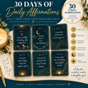 May include: A set of 30 daily affirmation cards featuring dark blue backgrounds with gold celestial illustrations and text. Each card displays a specific day number and an inspirational quote. The deck includes themes like self-love and healing.