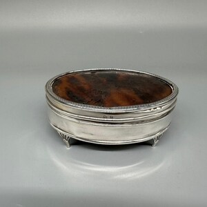 Antique silver jewelry box with gold decoration