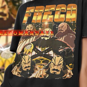 May include: A black t-shirt with a gold graphic print of a group of cartoon characters. The characters are wearing hats and have beards. The text "FRECCA EL COMANDANTE" is printed on the shirt.