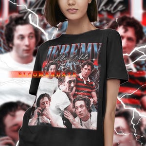 May include: Black t-shirt featuring a collage of images of Jeremy Allen White with the text "JEREMY Allen White" in a retro style. The design includes lightning bolt graphics and a blurred background.