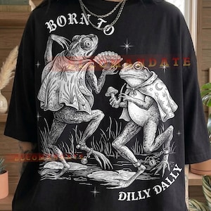 May include: A set of three ceramic mugs with a speckled, matte finish. The mugs are in shades of cream, light gray, and dark gray. Each mug has a simple, minimalist design, perfect for coffee or tea.