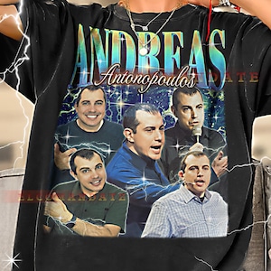 May include: Black t-shirt featuring a collage of images of Andreas Antonopoulos with the name "Andreas Antonopoulos" in a gradient font. The shirt has a vintage aesthetic with a blue and green background.