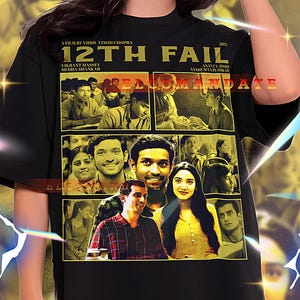 May include: Black unisex t-shirt featuring a movie poster design for "12th Fail". The design includes images of actors and the film's title in gold lettering. The shirt is a 2XL size.