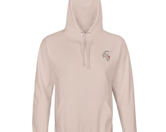 May include: A light beige hoodie with a drawstring hood and a kangaroo pocket. The hoodie features a small embroidered design on the upper left chest. The design is a line drawing of a goat with red accents.