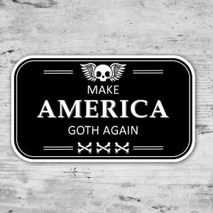 May include: Black and white sticker with a skull and crossbones design. The sticker says "Make America Goth Again".