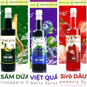 May include: Three bottles of Vina syrup with different flavors: pineapple, blueberry, and strawberry. Each bottle has a white cap and a label with the brand name and flavor. The pineapple syrup bottle is green, the blueberry is purple, and the strawberry is red.