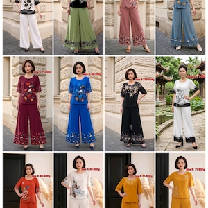 May include: A collection of twelve two-piece outfits consisting of short-sleeved tops and wide-leg trousers, each featuring floral or botanical prints in various colors including white, green, pink, blue, maroon, black, orange, and yellow.
