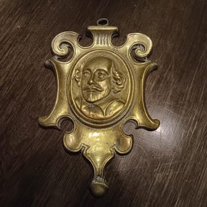 Antique William Shakespeare brass wall hanging