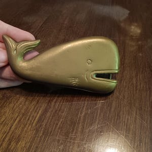 Laughing whale brass belt buckle