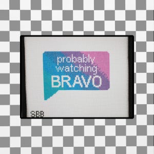 May include: A white needlepoint canvas featuring a speech bubble graphic with a blue to pink gradient. The text reads probably watching BRAVO in white letters. The letters SBB are printed in the bottom left corner of the canvas mesh.