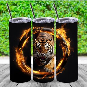May include: Three stainless steel tumblers with a black background and a tiger in a ring of fire design.