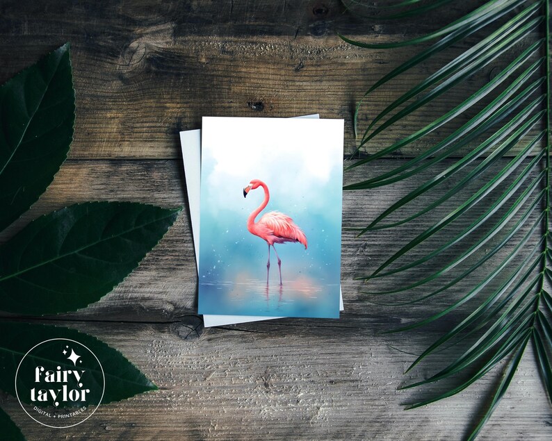 May include: A pink flamingo stands in a blue and white watercolor background. The flamingo is in a standing pose with its head tilted to the side. The background is a soft blue with white accents.