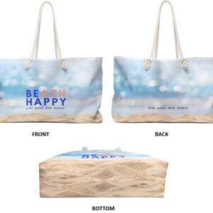 May include: A white canvas tote bag with a blue and white beach scene and the text "Beach Happy Surf Sand Sun Repeat" on the front. The back of the bag has the text "Surf Sand Sun Repeat". The bottom of the bag is sand colored.