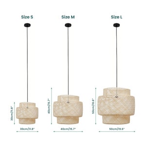 May include: Three sizes of a woven pendant light fixture with a black cord. The pendant light is made of natural woven material and has three tiers. The sizes are small, medium, and large. The measurements are 11.8 inches, 15.7 inches, and 19.6 inches.