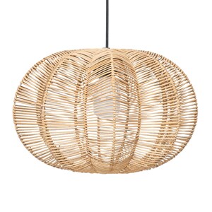 May include: A natural-toned, woven rattan pendant light fixture. The light has an oval shape with a bulb visible inside. The fixture is suspended from a black cord, perfect for adding a touch of natural texture to any room.