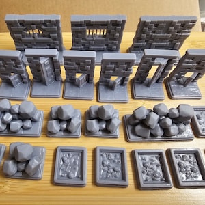 May include: A set of 3D printed miniature dungeon tiles for tabletop role-playing games. The set includes walls with windows and doors, rubble piles, and floor tiles.