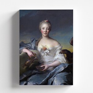 May include: A painting of a woman in a white dress and blue robe, holding a pitcher and a bowl. She has a flower in her hair and a bird perched on her shoulder.