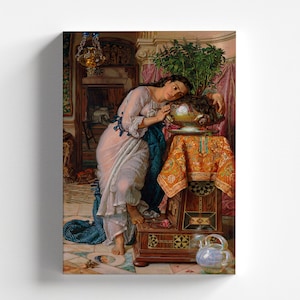 May include: A woman in a white dress with blue trim leans against a table with a bowl of fruit on it. The table is decorated with a colourful tablecloth and a carved wooden base. The woman is surrounded by plants and flowers.