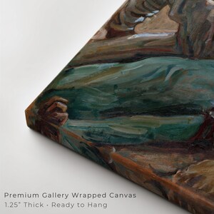 May include: A corner view of a gallery-wrapped canvas art print. The artwork features a landscape with shades of green, brown, and blue. The canvas is 1.25 inches thick and ready to hang. The text "Premium Gallery Wrapped Canvas" is visible.