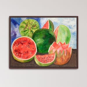 May include: A framed watercolor painting of watermelons. The painting features several whole and sliced watermelons in shades of green and red. The text "VIVA LA VIDA" is visible on a watermelon slice, along with the artist's name and the year 1954.